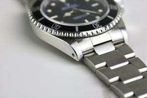 1997 ROLEX 14060 No-Date Submariner with Box & Papers